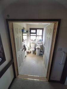 Double wooden doors with both doors open