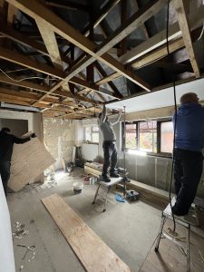 A building site with exposed roof rafters