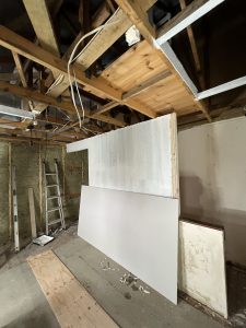 A building site with exposed roof rafters