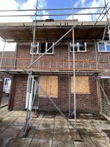 Scaffolding on a red brick house