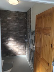 A bathroom with brown tiles