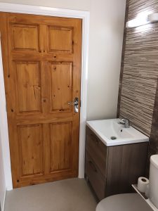 A bathroom with brown tiles