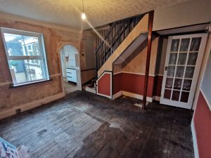 A room with red walls and a staircase