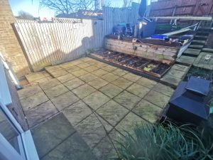 A patio with vegetable beds