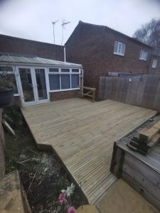 Wooden decking outside a conservatory