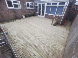 Wooden decking outside a conservatory
