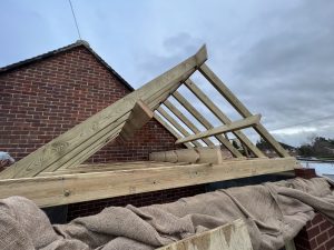 A building site with roof rafters showing