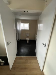 Open doors to a level access bathroom