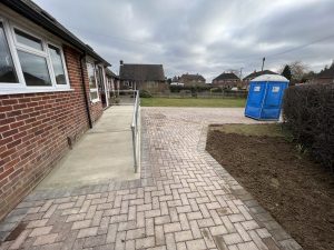 Newly finished block paving outside a red brick house