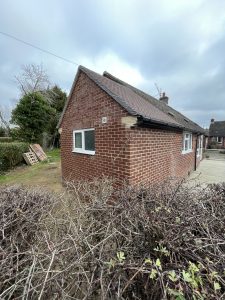 A single storey extension built from red bricks