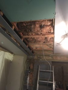 A room with ceiling insulation revealed