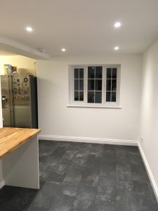 A utility room with wooden worktop