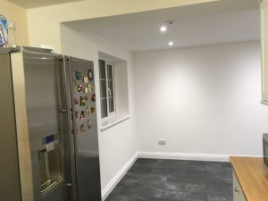 A kitchen with white walls