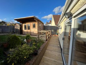 A wooden ramp leading into a bungalow