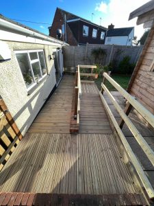 A wooden ramp leading into a bungalow