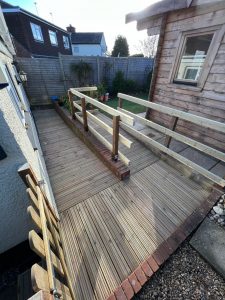 A wooden ramp next to a shed
