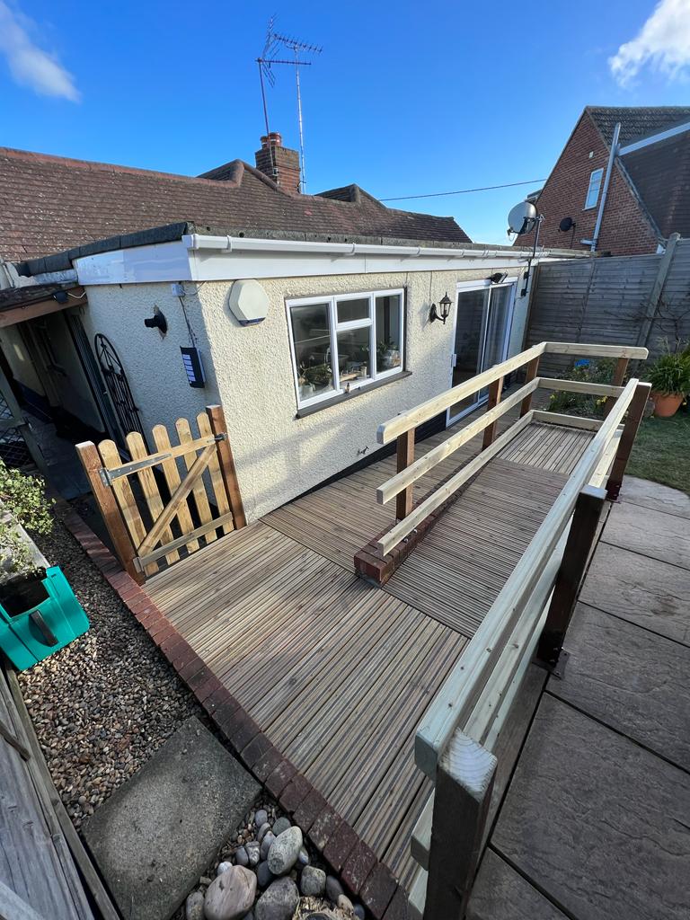 A wooden ramp leading into a bungalow
