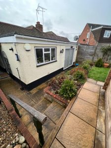 A bungalow with a garden