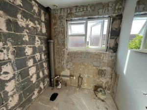 A room with bare bricks showing